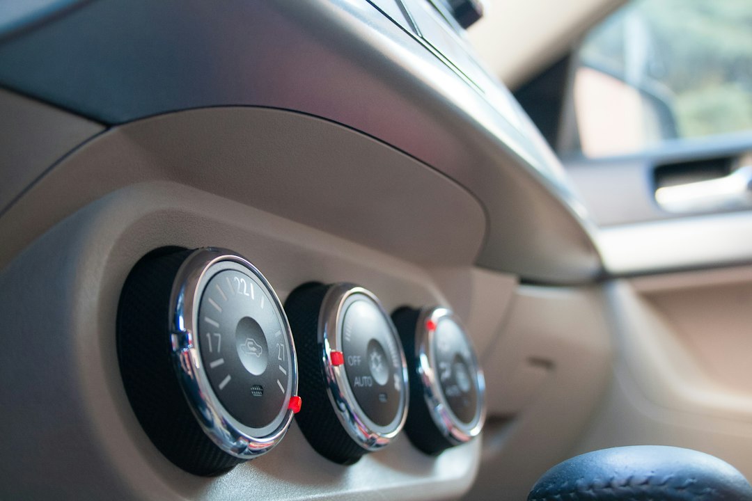 Climate control and air conditioning knobs on a car dashboard